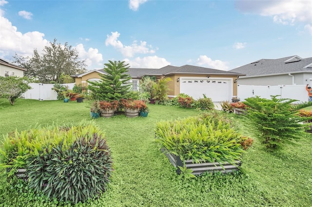 ranch-style house with a front yard and a garage