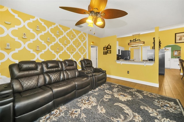 living room featuring hardwood / wood-style flooring and ceiling fan