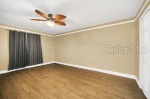 spare room featuring ceiling fan, ornamental molding, and hardwood / wood-style floors