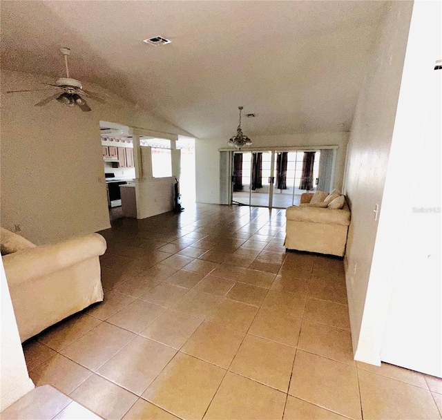 unfurnished living room featuring light tile patterned floors and ceiling fan