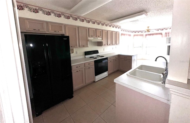 kitchen with sink, black fridge, a textured ceiling, light tile patterned floors, and electric range