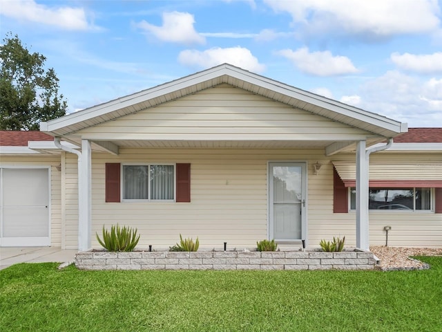 ranch-style home with a garage and a front yard