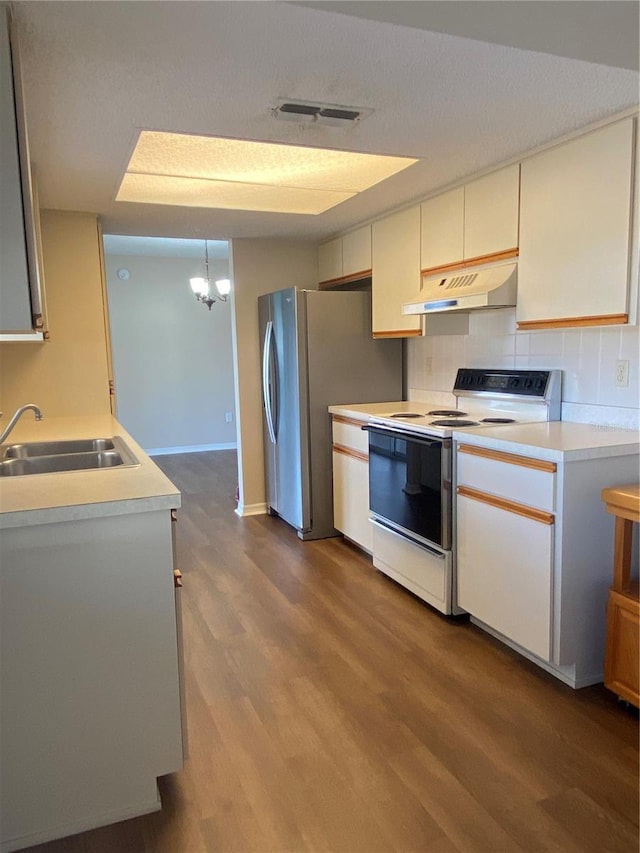 kitchen with decorative light fixtures, decorative backsplash, sink, white range with electric cooktop, and dark wood-type flooring