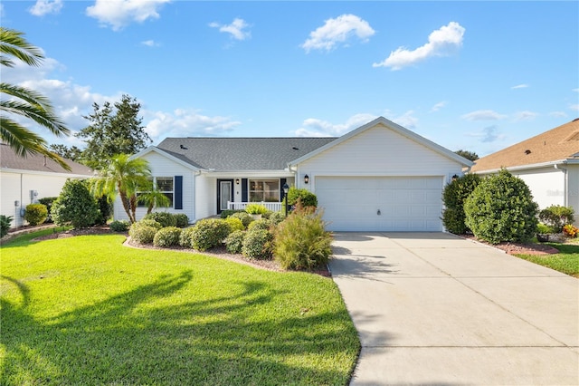 single story home featuring a front lawn and a garage