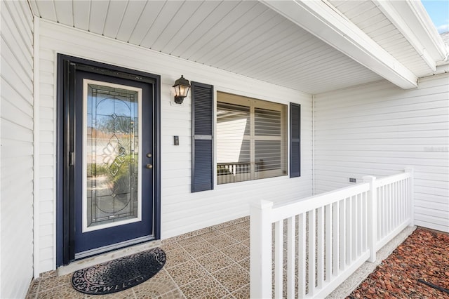 entrance to property featuring covered porch