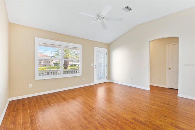 empty room featuring light hardwood / wood-style flooring, ceiling fan, and lofted ceiling