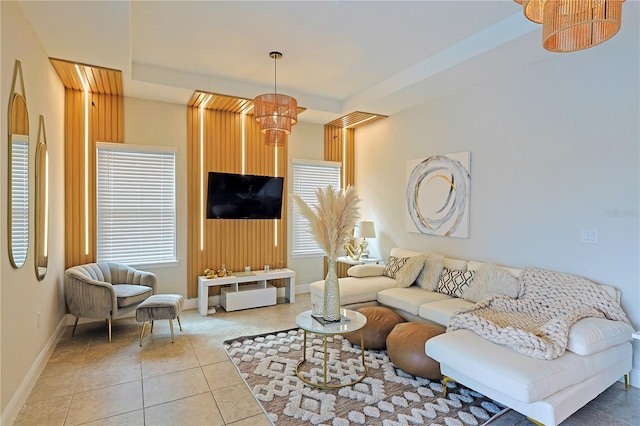 living room with an inviting chandelier and tile patterned flooring