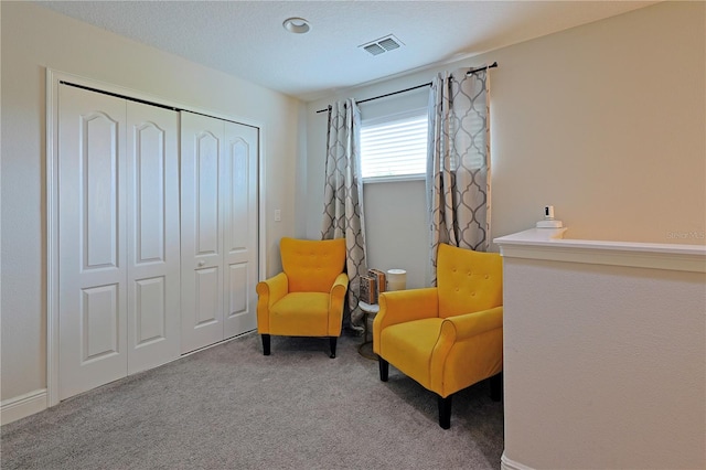 sitting room with light colored carpet