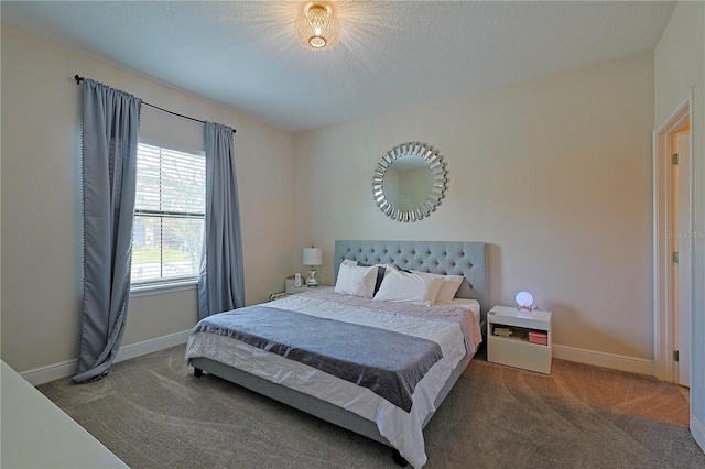 carpeted bedroom featuring a textured ceiling