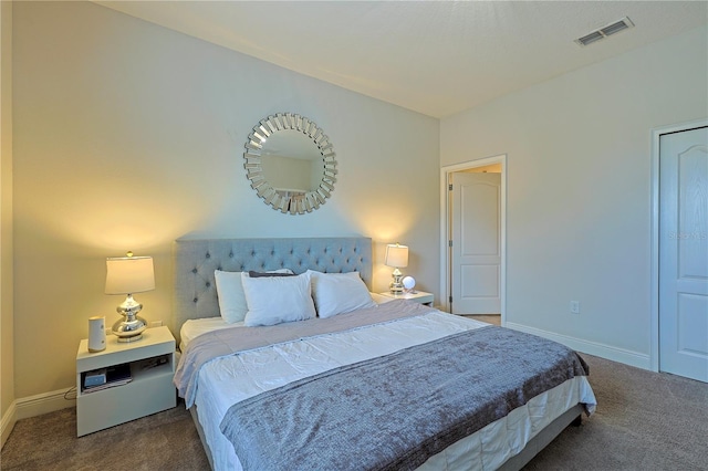 bedroom featuring dark colored carpet