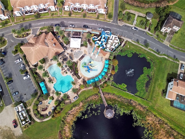 birds eye view of property with a water view