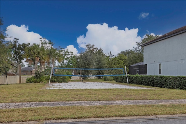 view of community with a yard and volleyball court