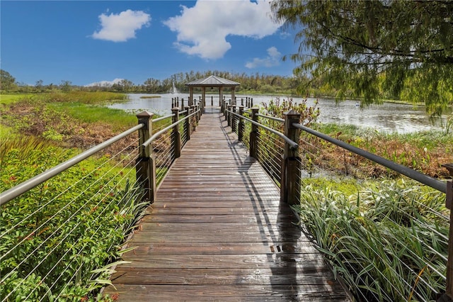 view of dock featuring a gazebo and a water view