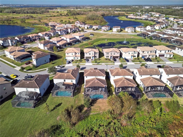 bird's eye view with a water view