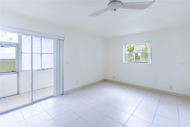 tiled empty room with ceiling fan