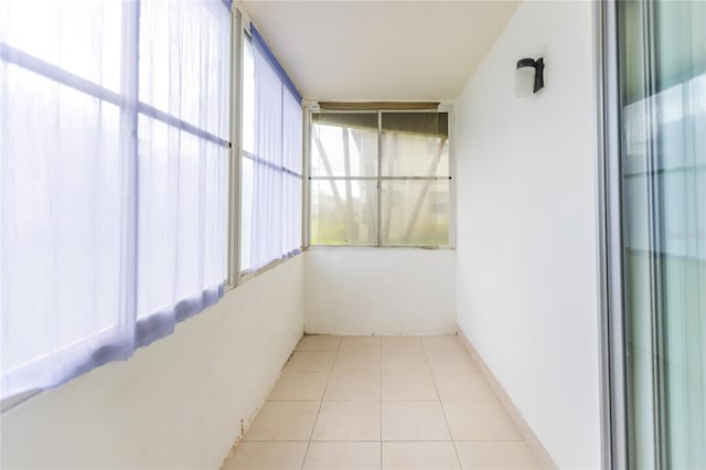 unfurnished sunroom featuring a wealth of natural light