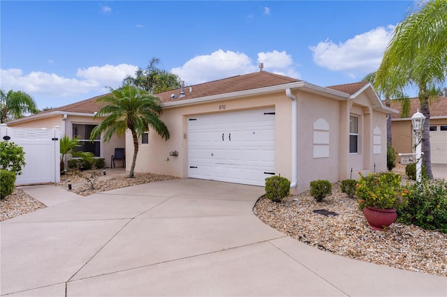 ranch-style house featuring a garage