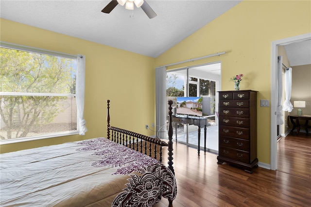 bedroom featuring ceiling fan, hardwood / wood-style flooring, a textured ceiling, and lofted ceiling