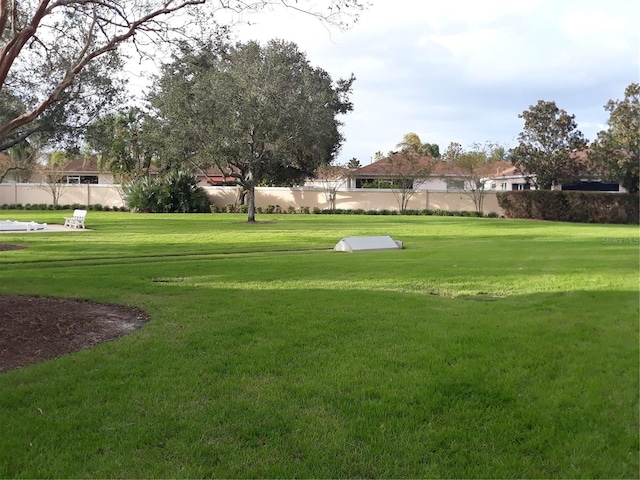 view of property's community with a lawn