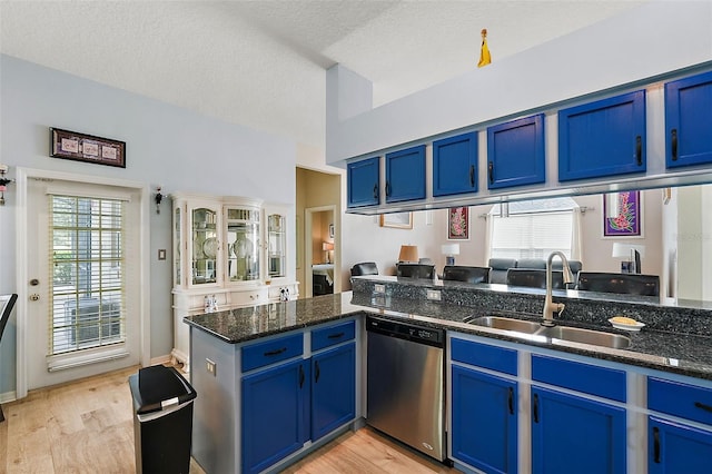 kitchen with dishwasher, light hardwood / wood-style flooring, and blue cabinetry