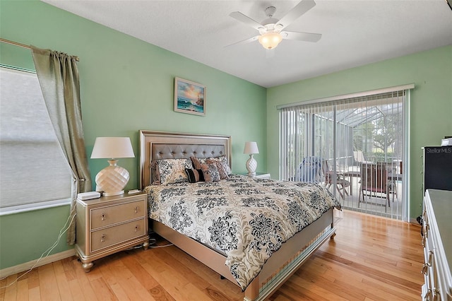 bedroom with ceiling fan, light wood-type flooring, and access to outside