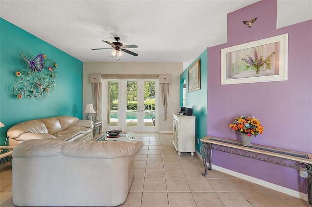 living room with french doors, ceiling fan, and light tile patterned flooring