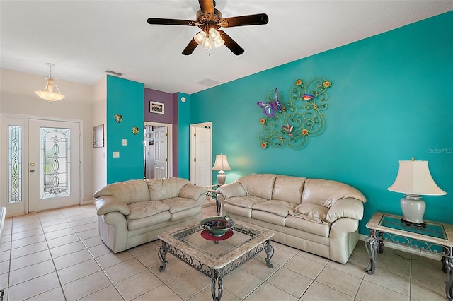 tiled living room featuring ceiling fan