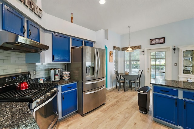 kitchen featuring light wood-type flooring, stainless steel appliances, blue cabinets, hanging light fixtures, and range hood