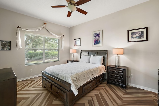 bedroom with parquet floors and ceiling fan