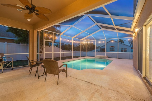 view of pool with a patio area, a lanai, and ceiling fan