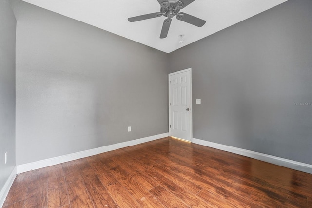 empty room featuring wood-type flooring and ceiling fan