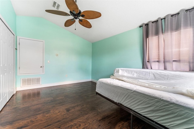 bedroom featuring a closet, ceiling fan, lofted ceiling, and dark hardwood / wood-style floors