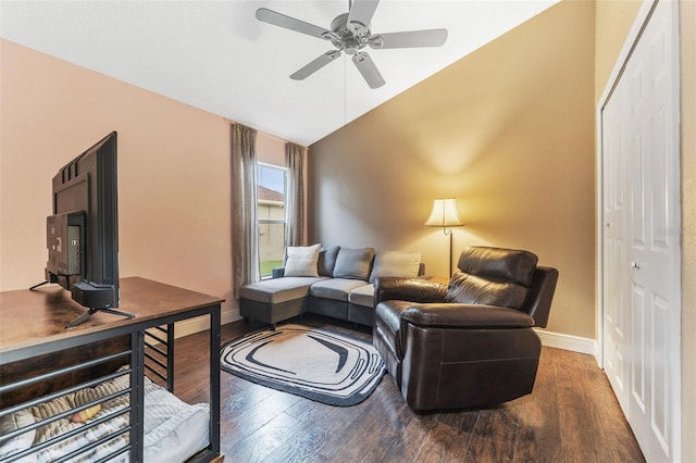 living room with hardwood / wood-style flooring, vaulted ceiling, and ceiling fan