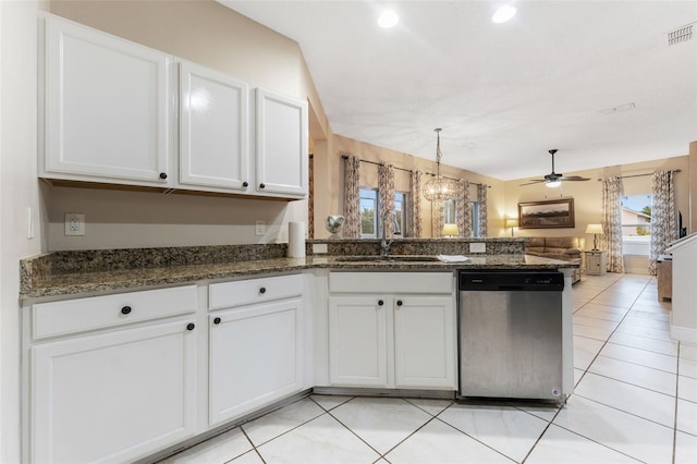 kitchen with kitchen peninsula, white cabinets, stainless steel dishwasher, and sink