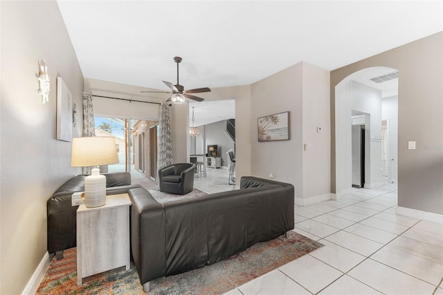 tiled bedroom with ceiling fan