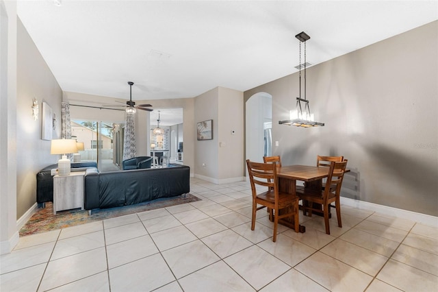 tiled dining area featuring ceiling fan