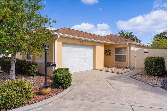 single story home featuring a garage