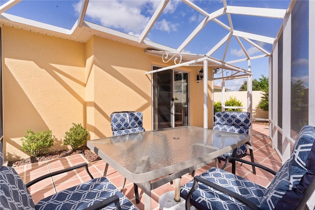 view of patio / terrace featuring a lanai