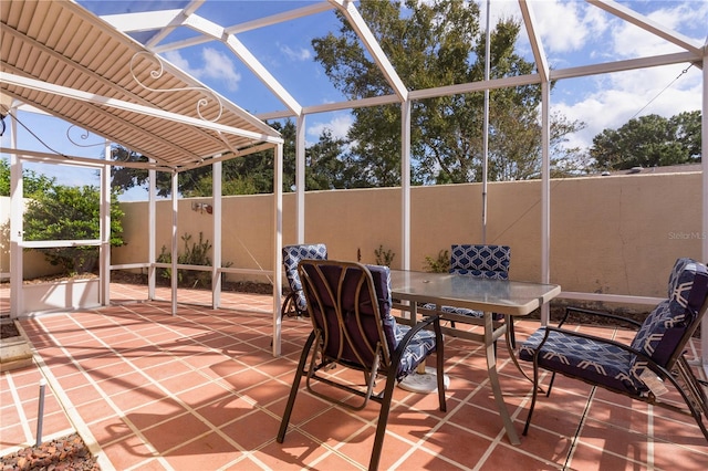 view of patio with a lanai