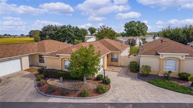 ranch-style home featuring a garage