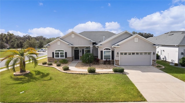 view of front of property with a front lawn and a garage