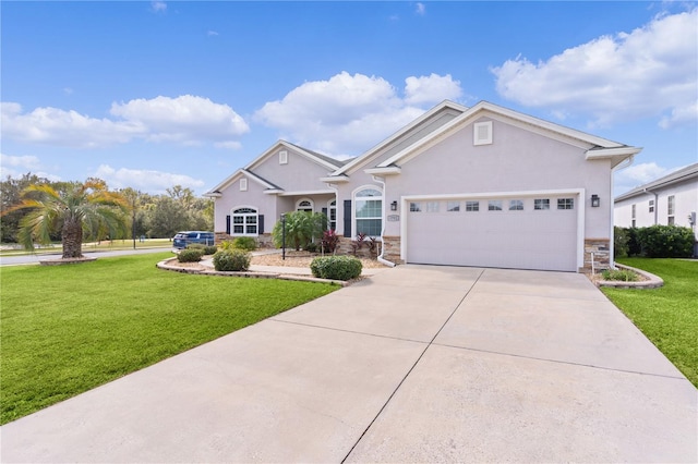 view of front facade with a front yard and a garage