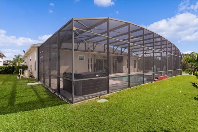 9702 Pepper Tree Pl, Wildwood, FL 34785 - rear view of house with an outdoor pool, a patio area, a ceiling fan, a lanai, and a yard