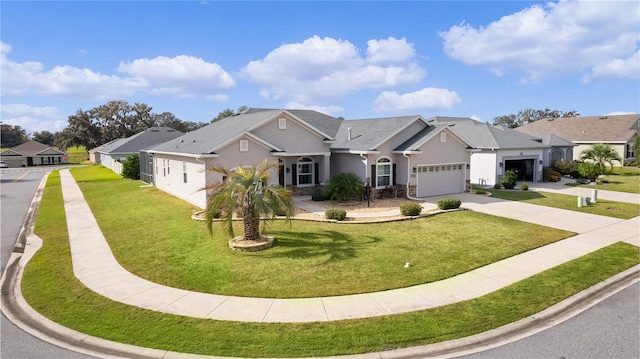 view of front of house featuring a front lawn and a garage