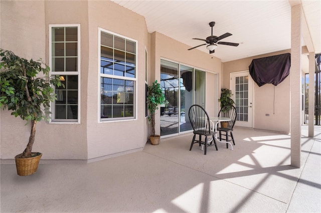 view of patio featuring ceiling fan