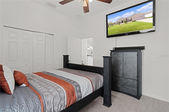 carpeted bedroom with a closet and ceiling fan