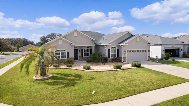 view of front of property with a garage and a front lawn