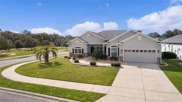 view of front of home featuring a front lawn and a garage