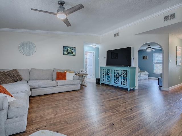 living room featuring a textured ceiling and dark wood-type flooring