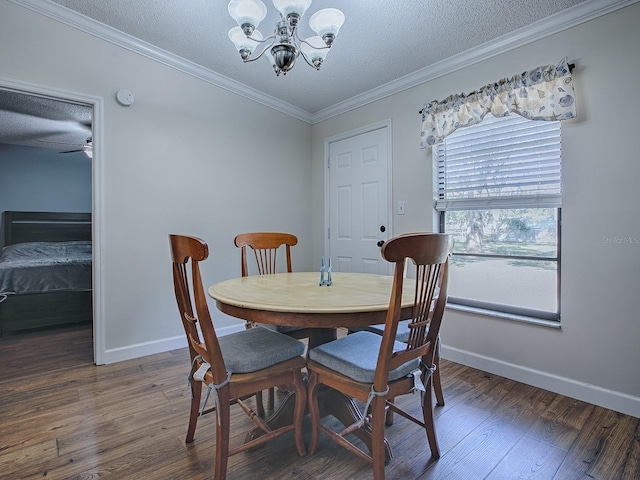 dining area with crown molding, a textured ceiling, ceiling fan with notable chandelier, and dark hardwood / wood-style flooring